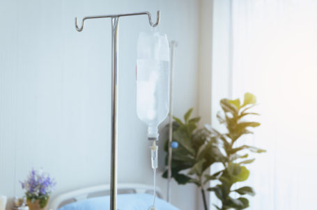Close up of bottle saline solution and treatment in a hospital
