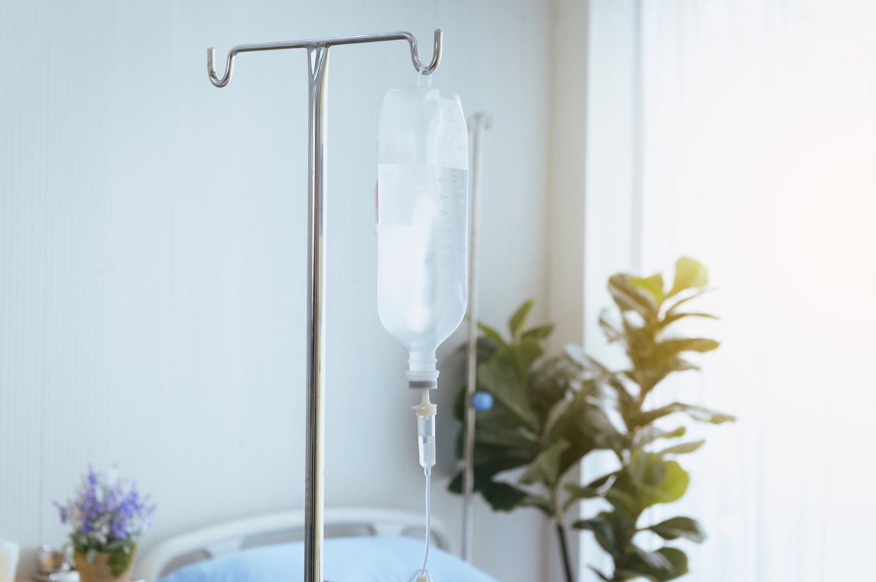 Close up of bottle saline solution and treatment in a hospital