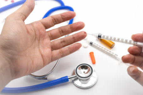 Image of a healthcare worker experiencing a needlestick injury